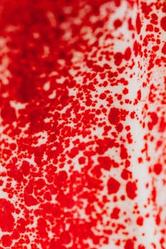 Close-up macro shot of red anthurium flower creating an abstract and textured pattern.