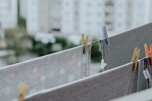 Free Linen hanging on clothesline with clothespins Stock Photo