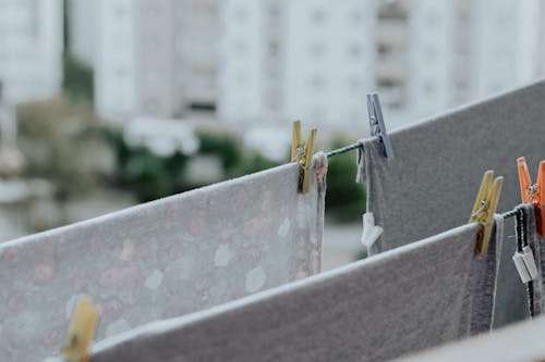 Linen hanging on clothesline with clothespins