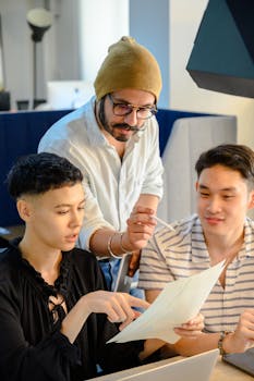 Group of diverse adults collaborating in a modern office environment.