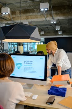 Team collaborating in a modern office with a focus on creative solutions and business development.