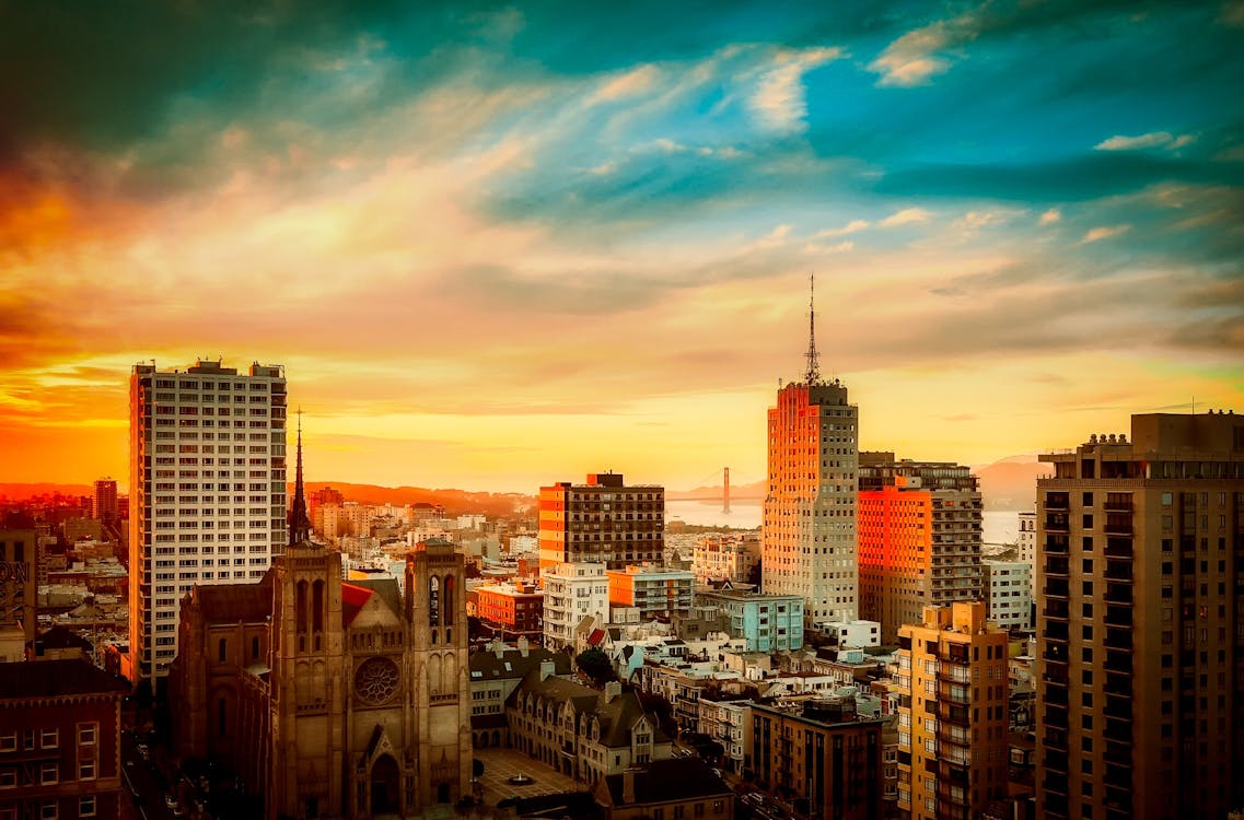 Free Buildings Under Cloudy Sky during Sunset Stock Photo