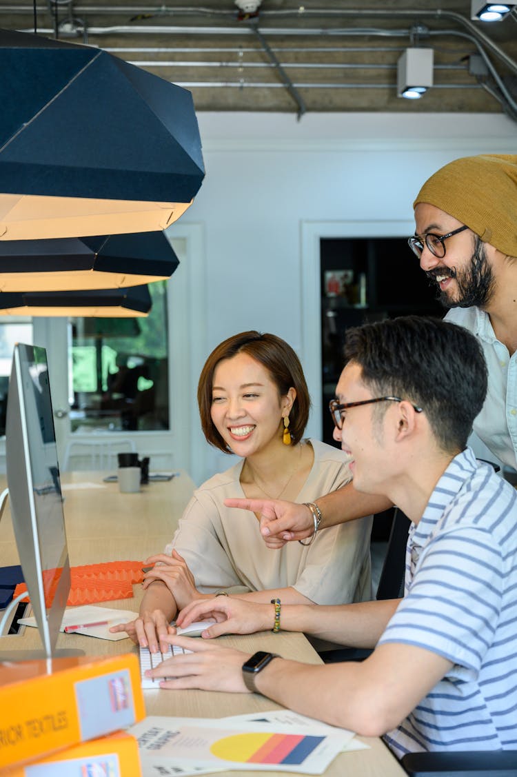 Bearded Man Pointing His Finger On The Monitor Screen 