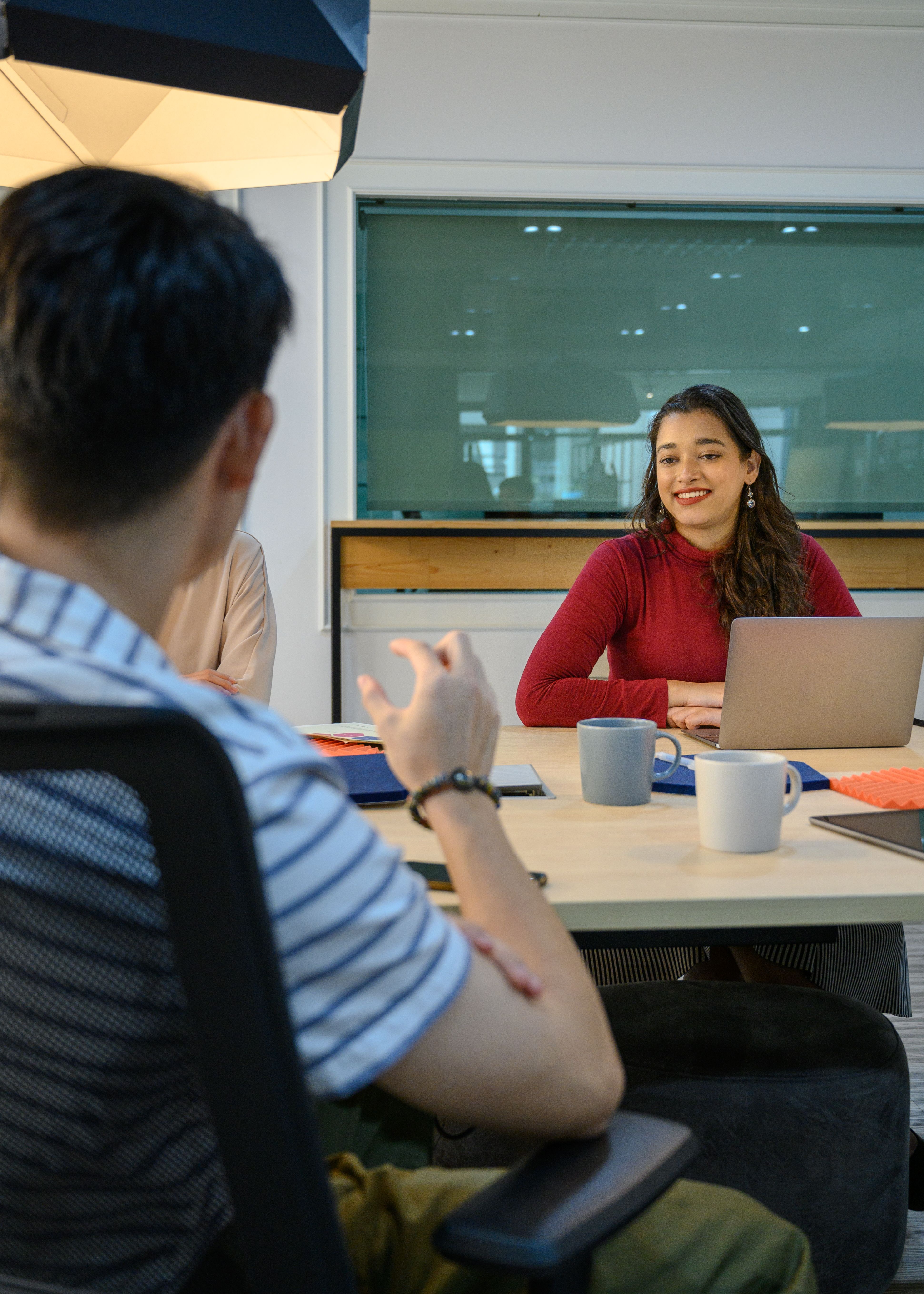 Coworkers discussing projects in an office
