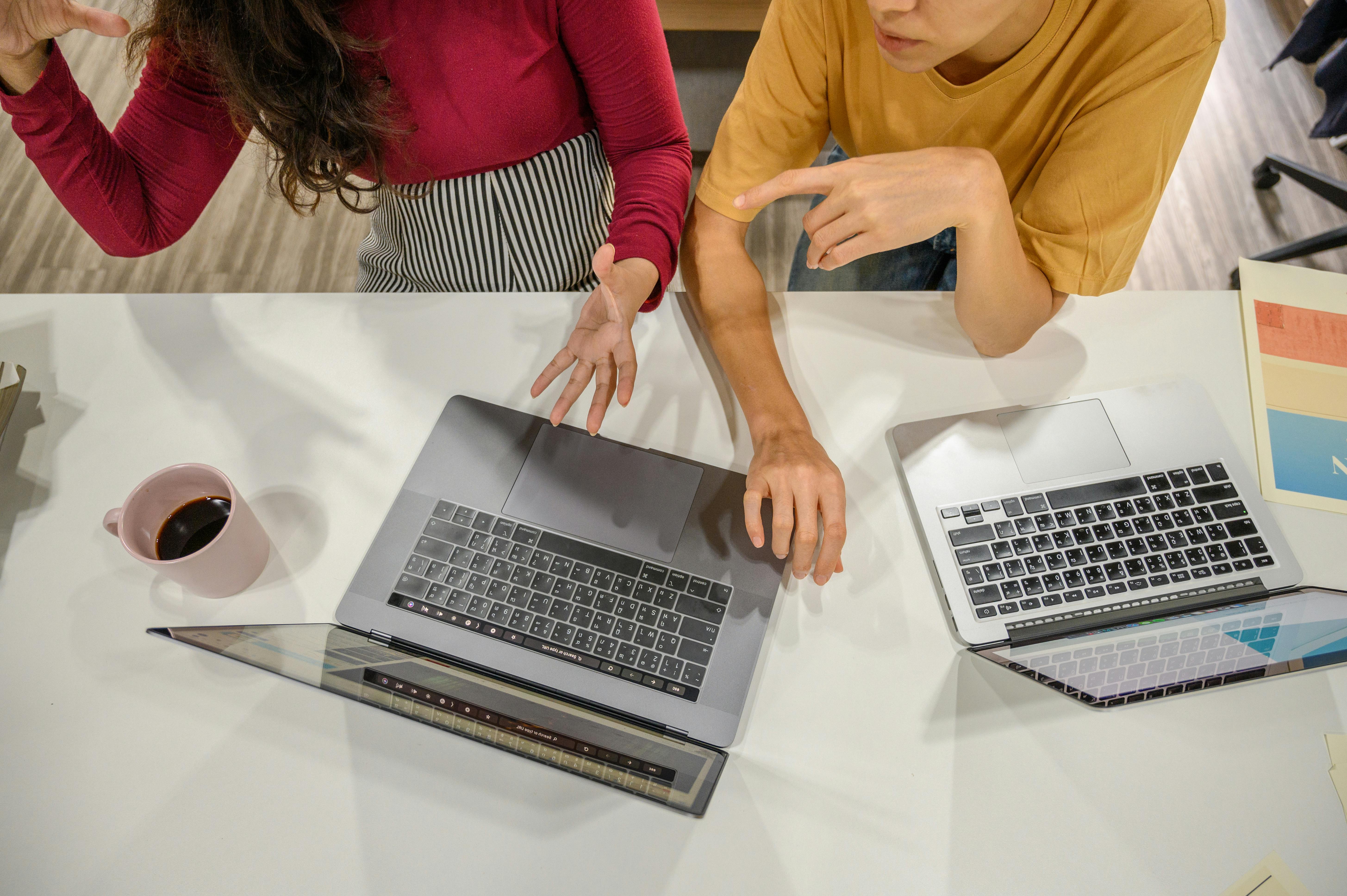 two women discussing at work