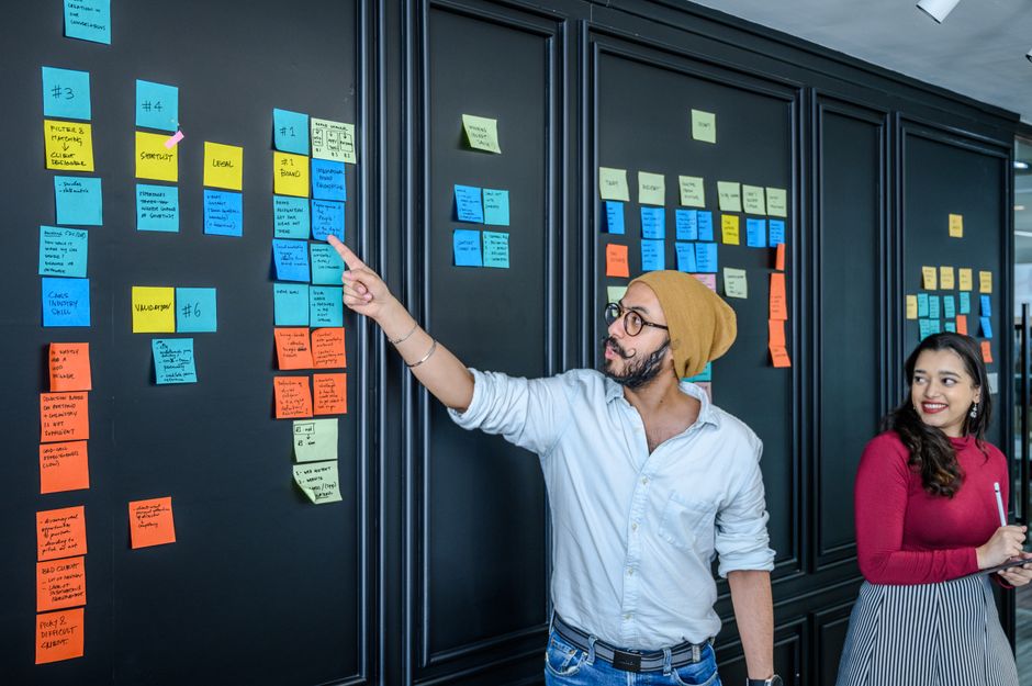 Team brainstorming ideas during an office meeting with notes