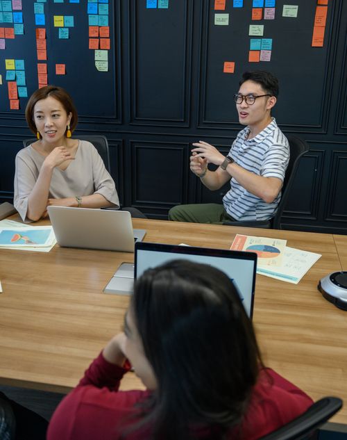 Free Engaging business meeting with diverse team members discussing projects and ideas in a modern office. Stock Photo
