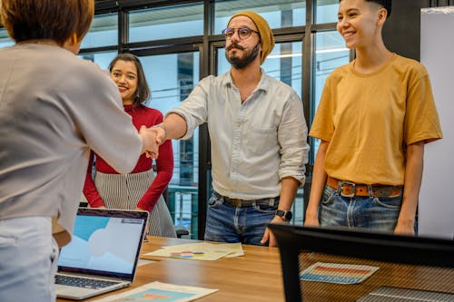 People Shaking Hands on Business Meeting