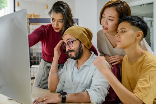 Concerned People Working on Computer