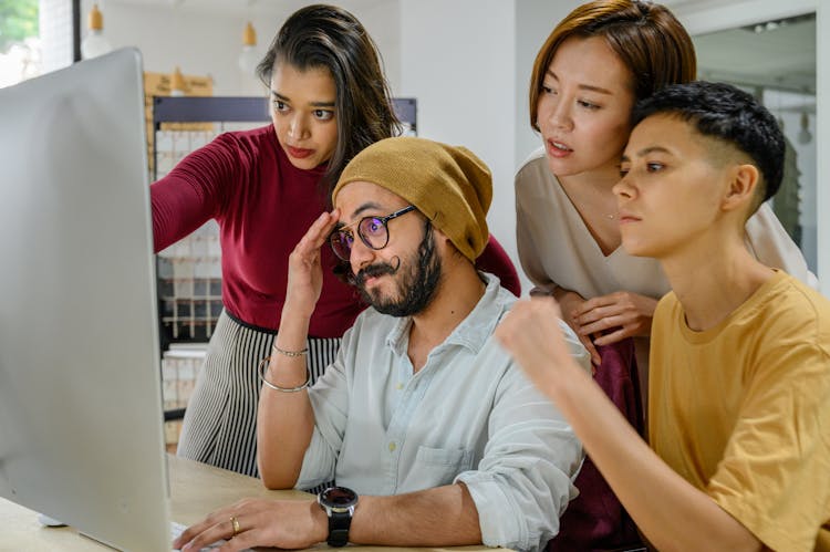 Concerned People Working On Computer