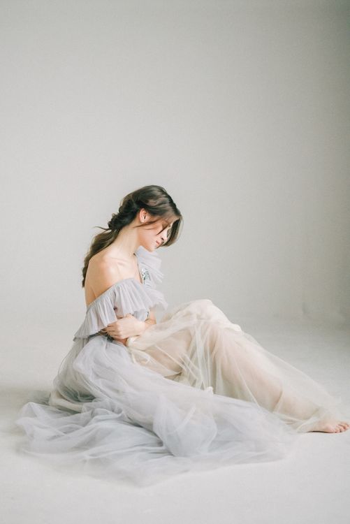 A Woman in White Dress Sitting on the Floor Free Stock Photo A Woman in White Dress Sitting on the Floor Free Stock Photo