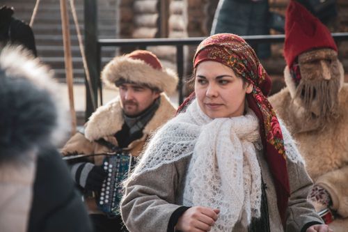 Free Celebrate Russian culture at a vibrant winter festival in Moscow with traditional clothing and music. Stock Photo