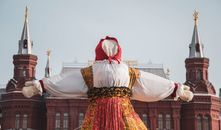 A vibrant festival doll at Maslenitsa in Moscow's Red Square, highlighting Russian culture.