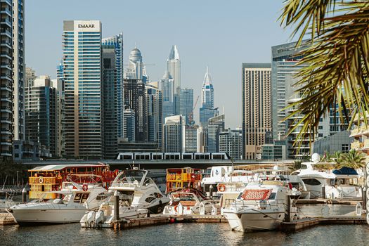 Explore the iconic Dubai Marina with luxury yachts and stunning skyscrapers lining the skyline.
