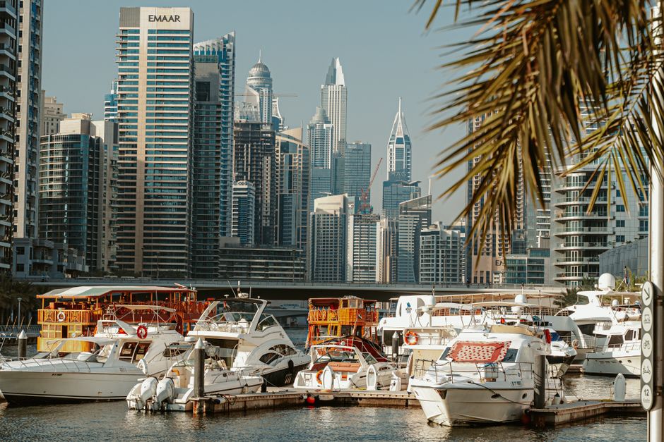 Incredible Luxury Shared Yacht Tour in Dubai Marina with Food Review 2026 - A captivating view of yachts docked at Dubai Marina with skyscrapers in the background.