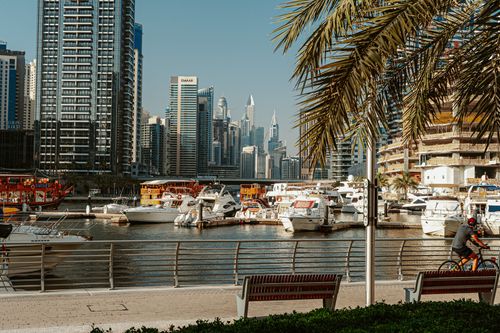 Free A vibrant view of Dubai Marina featuring yachts and skyscrapers on a sunny day. Stock Photo