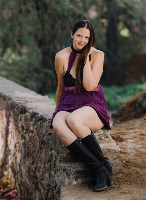 A Woman in Black and Purple Dress