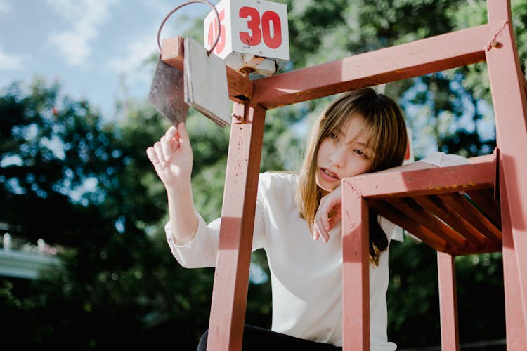 Sand Young Ethnic Female Teenager Sitting On Referee Chair