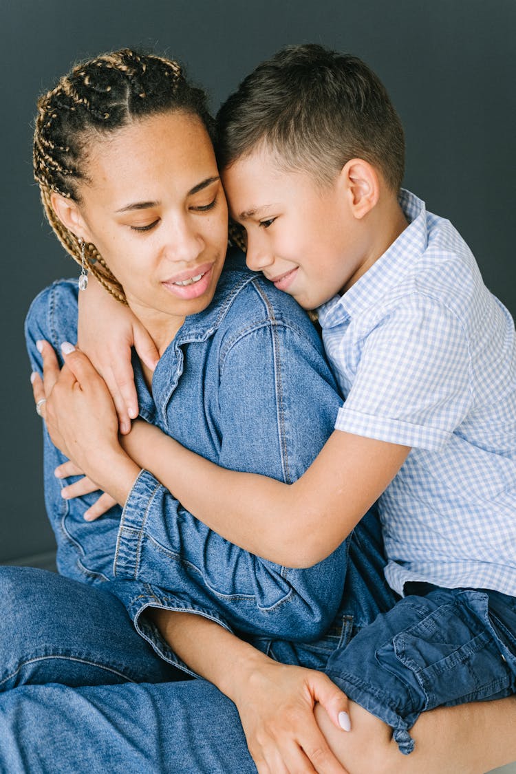 Child Hugging Mother From Behind