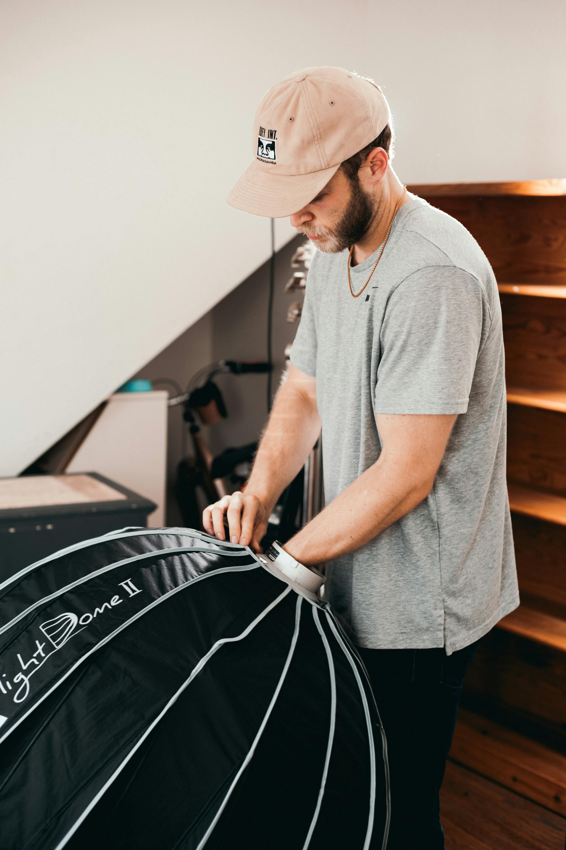 man in gray polo shirt and white hat