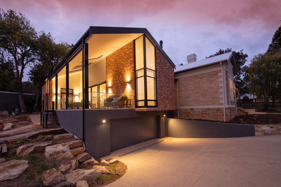 Beautifully renovated home exterior with brick accents - oakley back to wall toilet