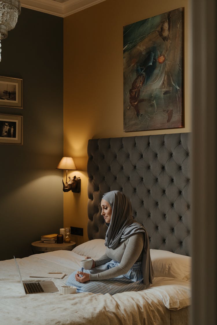 Woman In Gray Hijab Using Laptop