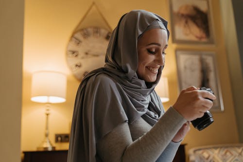 Free Woman in Gray Long Sleeve Shirt Wearing Gray Hijab Stock Photo