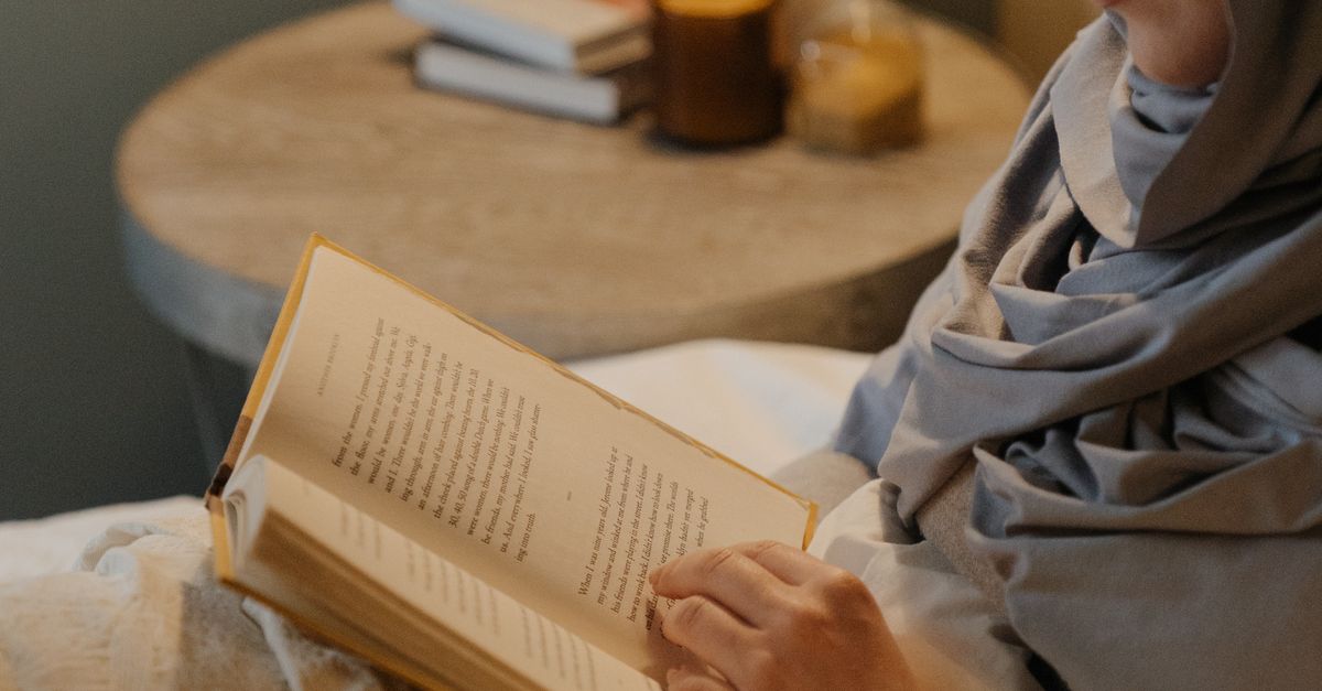 The Reading Robe Woman in Gray Robe Reading Book · Free Stock Photo