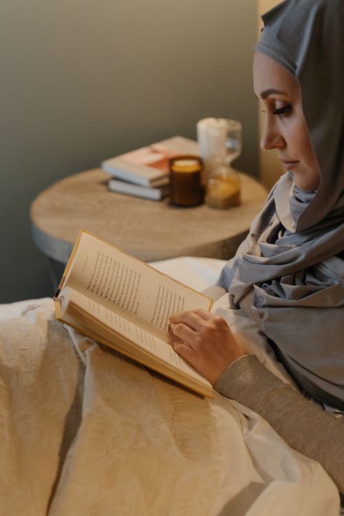 Woman in White Hijab Lying on Bed · Free Stock Photo
