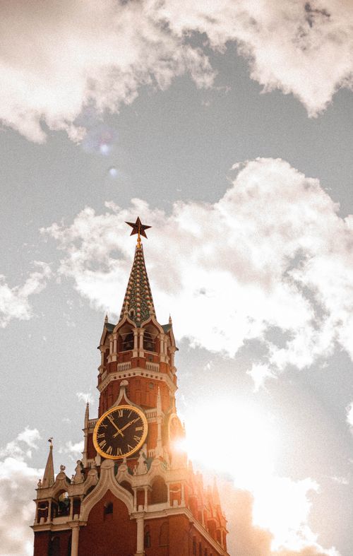 Free Iconic Spasskaya Tower against a bright sky in daylight at the Moscow Kremlin. Stock Photo
