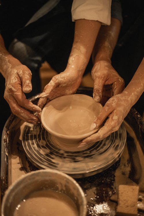 Hands Molding a Brown Clay 