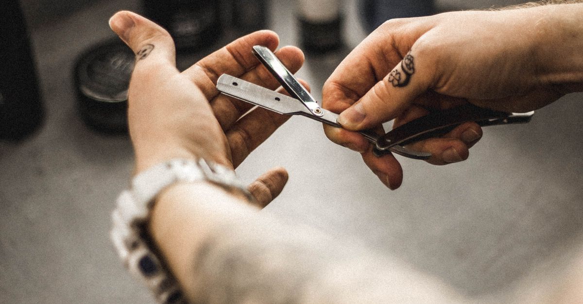 Hands Holding Straight Razor · Free Stock Photo
