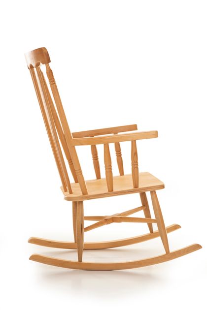 Wooden rocking chair on a white backdrop, photo by Engin Akyurt on Pexels