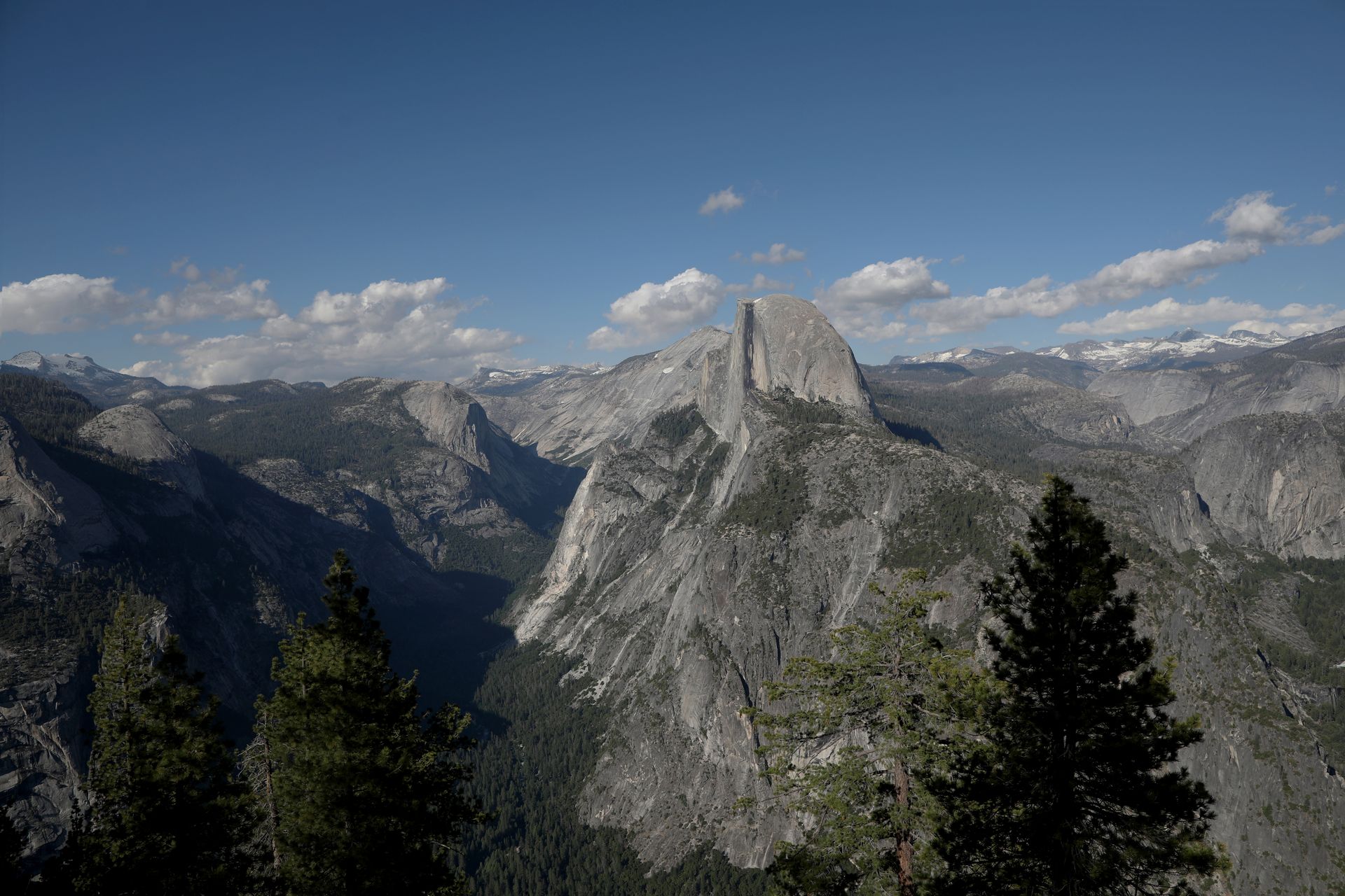 A stunning aerial view of Half Dome in Yosemite National Park, showcasing the majestic Sierra Nevada mountains.
