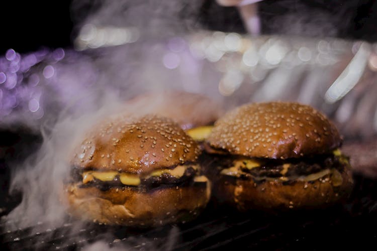 Burger On Black Metal Grill