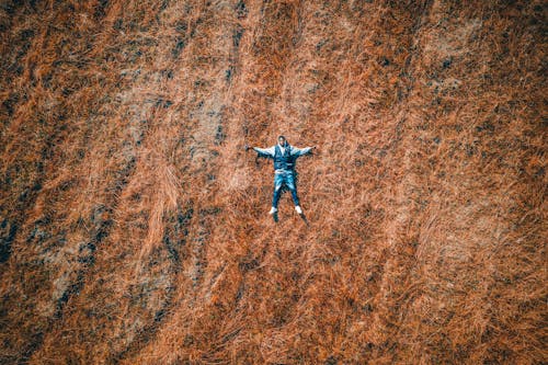 Aerial Shot of a Man Lying Down on the Ground