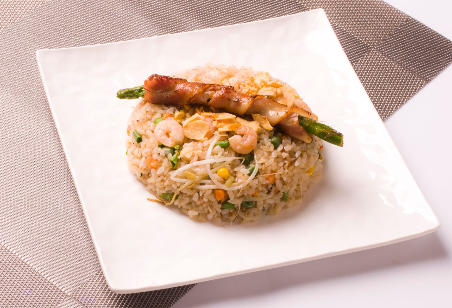 Bacon wrapped asparagus with cheese sauce and crispy onions