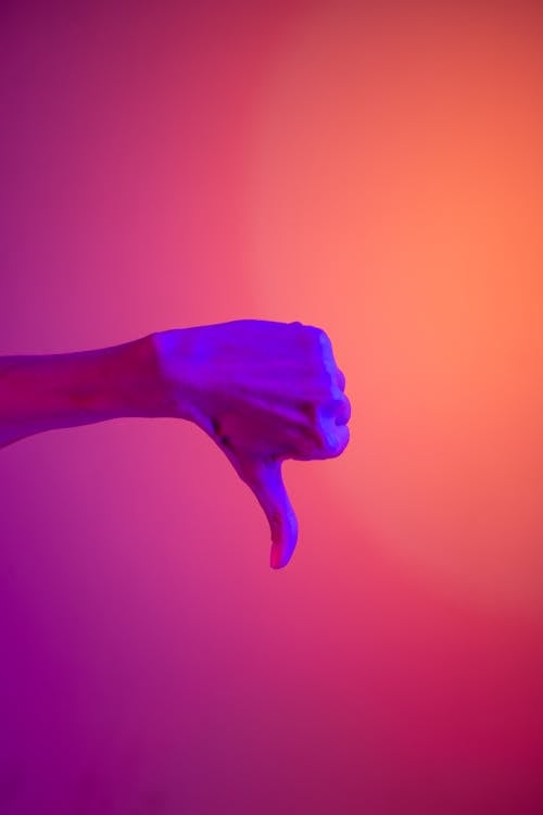 Visual of a person's Hand Doing Thumbs down