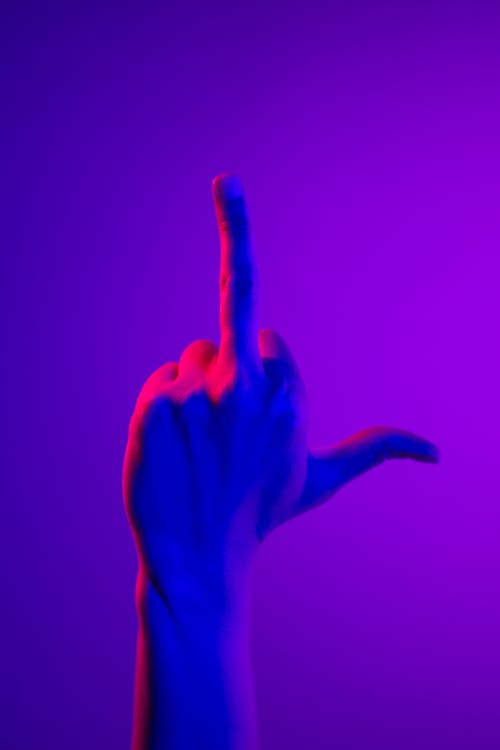 Free Persons Hand Doing Peace Sign Stock Photo