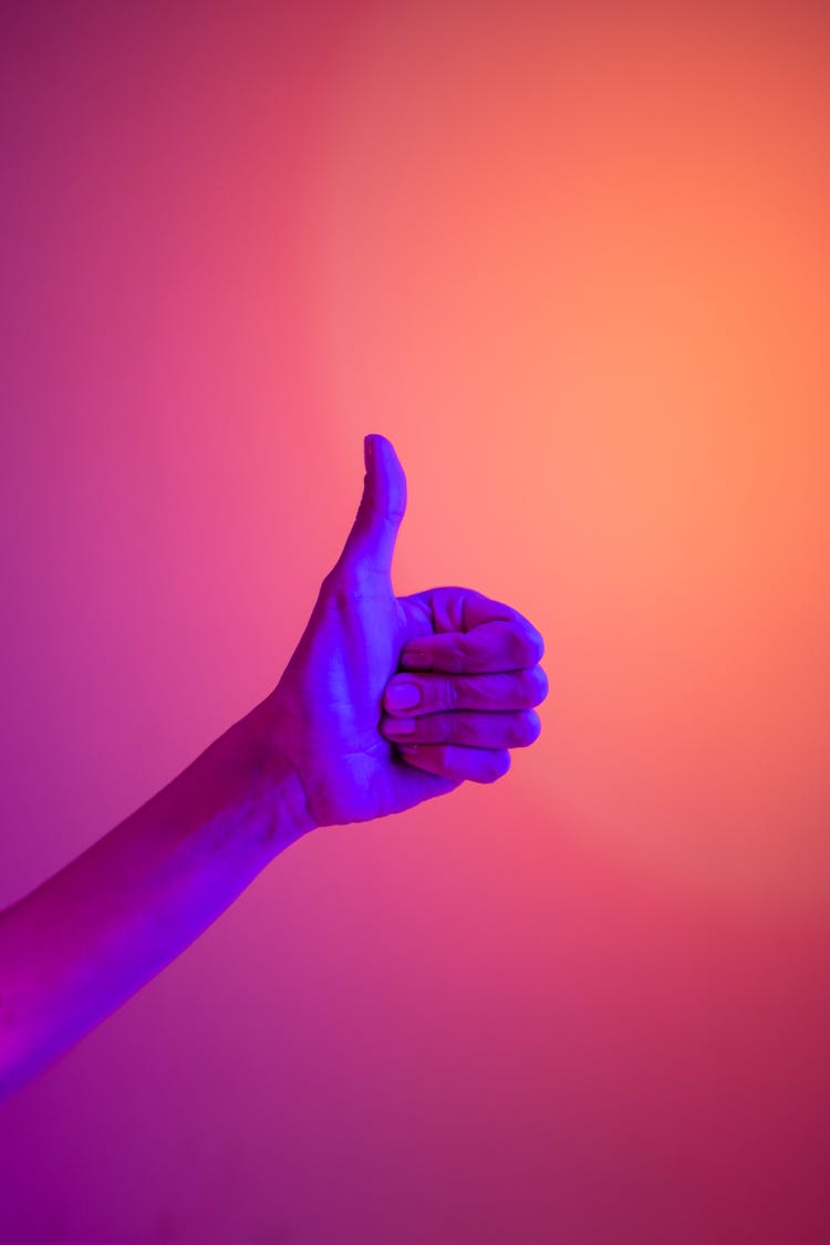 Persons Hand Doing Thumbs Up