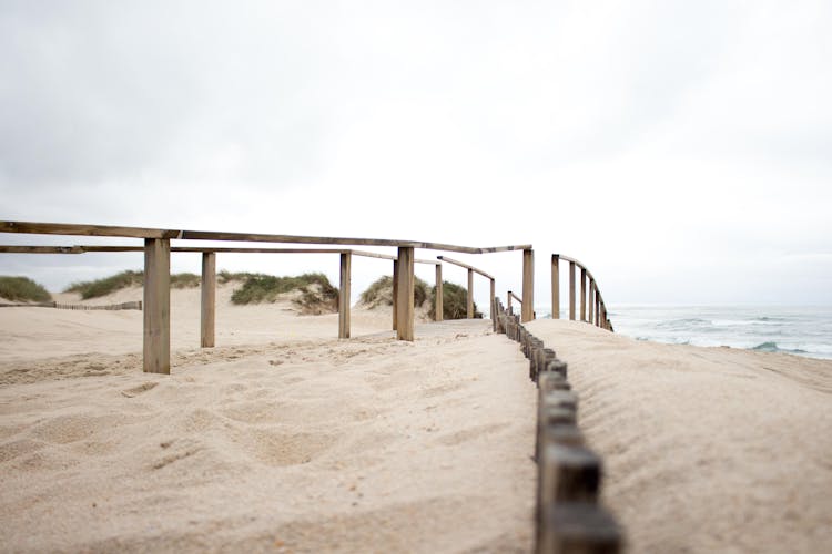 Wooden Railings Leading To The Beach