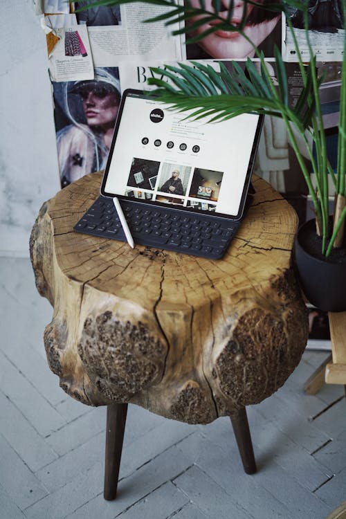 Free Ipad with Keyboard on a Wooden Table Stock Photo