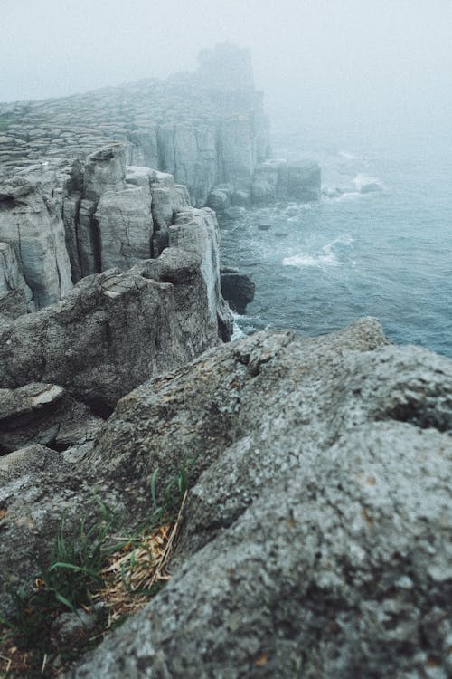 Gray Rocky Mountain Beside Body of Water