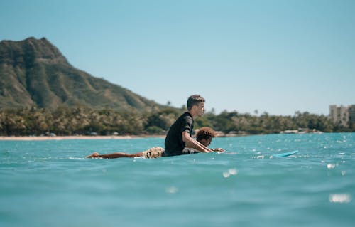 Free Photo Of People Riding Surfboard Stock Photo