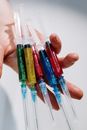 Close-Up Photo Of Person Holding Syringe