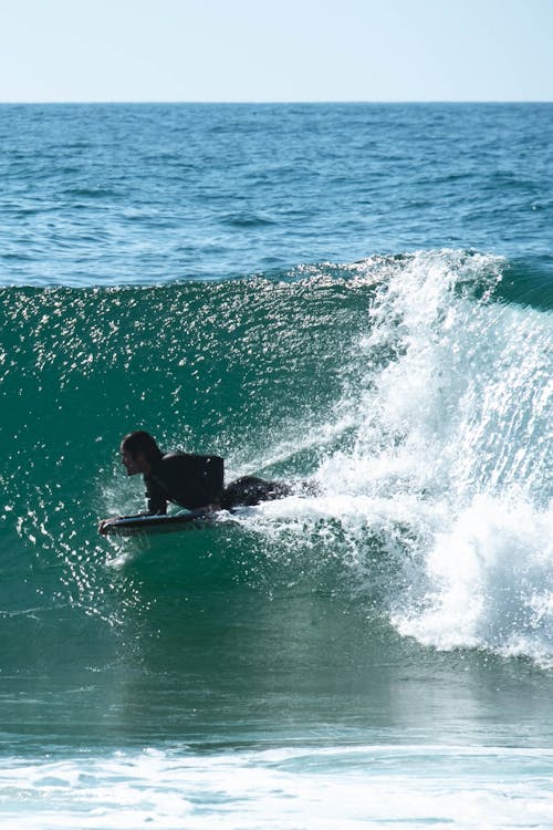 Photo Of Man Surfing