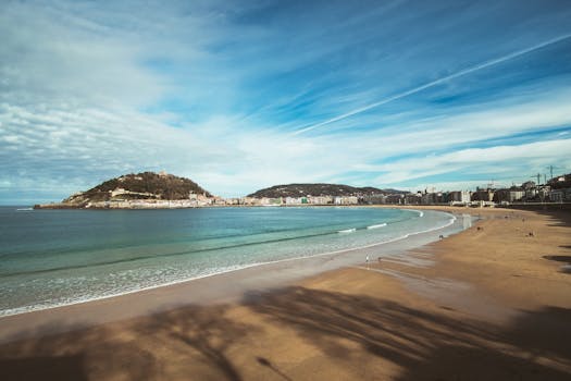 Serene beach scene with waves at Donostia-San Sebastián in Spain.