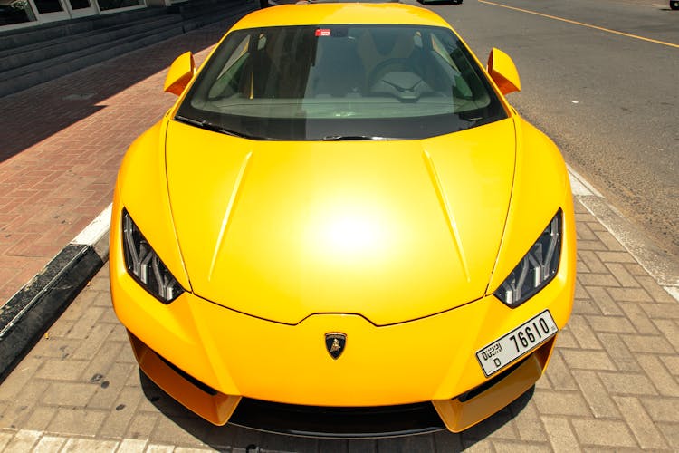 Yellow Lamborghini Sports Car Parked On The Street