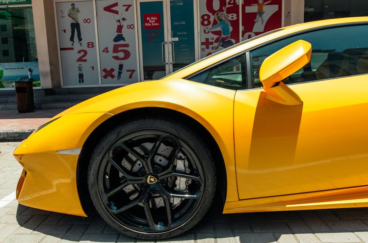 Yellow Lamborghini Car Parked On The Street