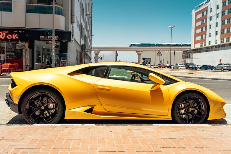 Photo Of Yellow Lamborghini Parked Beside Road